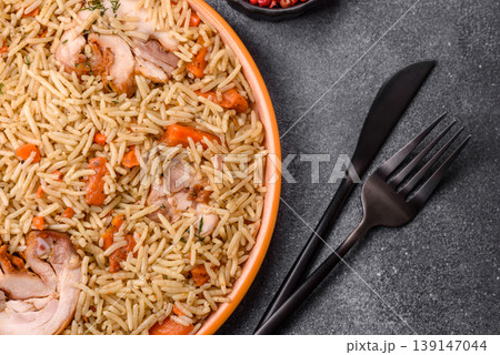 Kabsa or mandi, an Arabic dish with rice and chicken, salt, and spices. Kabsa or mandi Kabsa or mandi, an Arabic dish with rice and chicken, salt, and spices. Kabsa or mandi 139147044