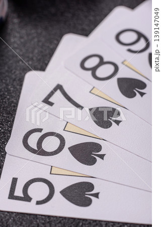 Playing cards and chips on a table, a gambling game of poker. Cards and chips Playing cards and chips on a table, a gambling game of poker. Cards and chips 139147049
