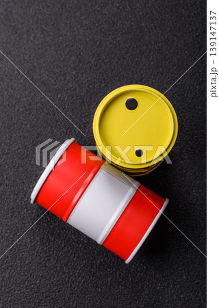 Metal barrels containing oil, gas, or chemicals, global fuel prices, and trends. Oil barrels 139147137