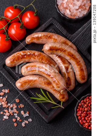 Grilled pork or chicken sausages, smoked fried food with salt and spices. Grilled sausages Grilled pork or chicken sausages, smoked fried food with salt and spices. Grilled sausages 139147208