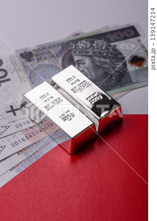 A silver bar, white metal against a backdrop of Polish flag, as a concept. A silver bar A silver bar, white metal against a backdrop of Polish flag, as a concept. A silver bar 139147214