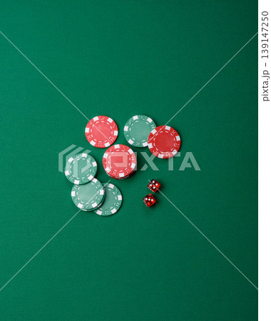 Casino dice and chips on a colored background, poker, gambling with bets. Dice and chips Casino dice and chips on a colored background, poker, gambling with bets. Dice and chips 139147250