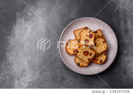Fruit cake, a dessert with cherries, plums, and raisins for a festive Christmas table. Fruit cake Fruit cake, a dessert with cherries, plums, and raisins for a festive Christmas table. Fruit cake 139147256