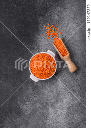 Raw red lentils as a source of protein for a healthy vegan meal. Red lentils Raw red lentils as a source of protein for a healthy vegan meal. Red lentils 139147279