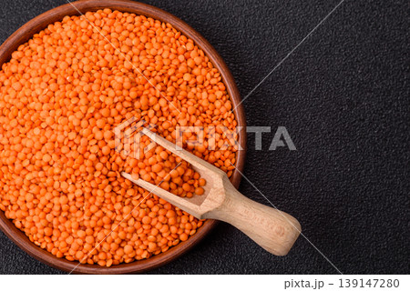 Raw red lentils as a source of protein for a healthy vegan meal. Red lentils Raw red lentils as a source of protein for a healthy vegan meal. Red lentils 139147280