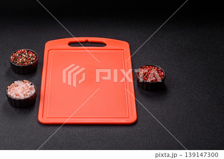 An empty plastic cutting board as a kitchen utensil. An empty plastic cutting board 139147300