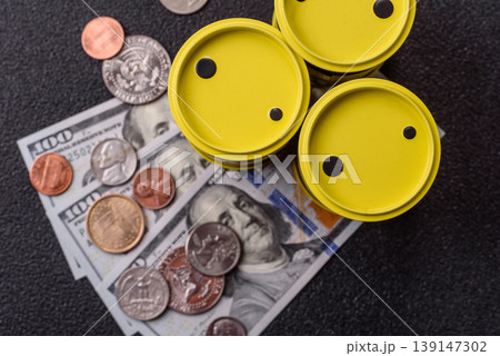A barrel of oil against a backdrop of dollars as a concept for the oil crisis. A barrel of oil A barrel of oil against a backdrop of dollars as a concept for the oil crisis. A barrel of oil 139147302