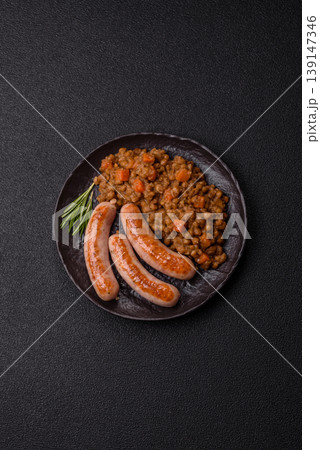 Lentil, carrot, and tomato stew with sausages, a European dish. Lentils with sausages Lentil, carrot, and tomato stew with sausages, a European dish. Lentils with sausages 139147346