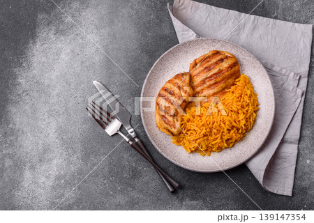 Dajaj Mashwi, an Arabic dish with rice and chicken, salt, and spices. Dajaj Mashwi as a background Dajaj Mashwi, an Arabic dish with rice and chicken, salt, and spices. Dajaj Mashwi as a background 139147354