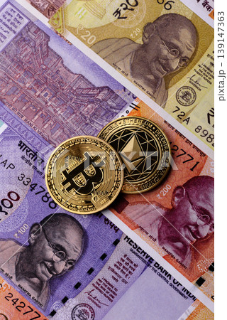 A conceptual financial background, Bitcoin against the Rupee. Bitcoin on the Indian currency A conceptual financial background, Bitcoin against the Rupee. Bitcoin on the Indian currency 139147363