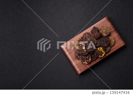 Organic Chinese green pu-erh tea with various herbs in round bricks. Chinese pu-erh tea 139147416