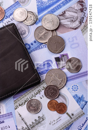 United Arab Emirates cash, dirhams and coins for exchange and financial transactions. UAE currency United Arab Emirates cash, dirhams and coins for exchange and financial transactions. UAE currency 139147418