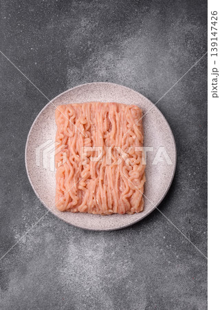 Raw fresh ground chicken, turkey, or pork for burgers or meatballs. Raw ground chicken Raw fresh ground chicken, turkey, or pork for burgers or meatballs. Raw ground chicken 139147426