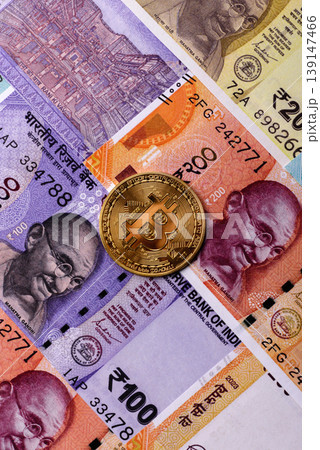A conceptual financial background, Bitcoin against the Rupee. Bitcoin on the Indian currency A conceptual financial background, Bitcoin against the Rupee. Bitcoin on the Indian currency 139147466