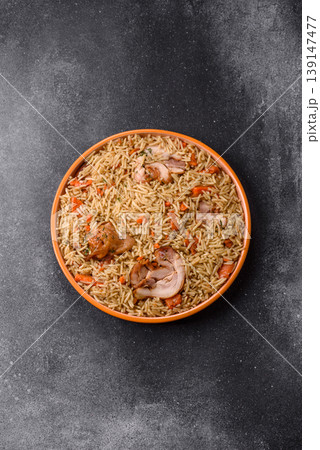 Kabsa or mandi, an Arabic dish with rice and chicken, salt, and spices. Kabsa or mandi Kabsa or mandi, an Arabic dish with rice and chicken, salt, and spices. Kabsa or mandi 139147477