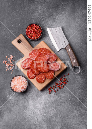 Sliced smoked pepperoni or salami as a pizza topping. Pepperoni sausage 139147491