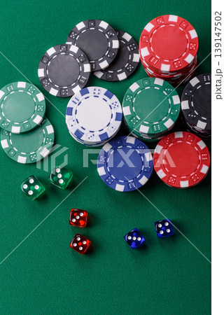 Multicolored casino chips as a conceptual backdrop for gambling games. Multicolored casino chips 139147502