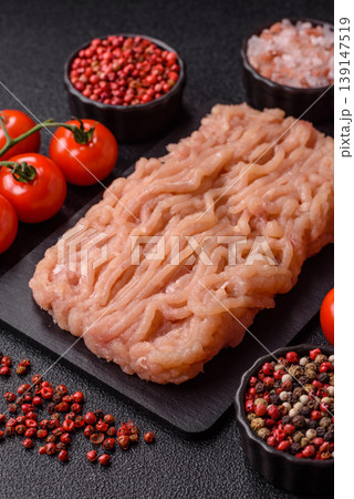 Raw fresh ground chicken, turkey, or pork for burgers or meatballs. Raw ground chicken Raw fresh ground chicken, turkey, or pork for burgers or meatballs. Raw ground chicken 139147519