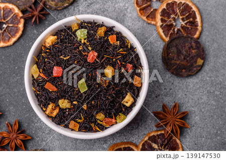 Dry black tea with herbal leaves and aromatic additives. Dry fruity black tea 139147530