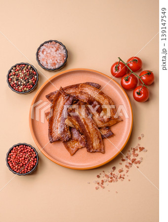 Fried fresh bacon slices with layers of meat or prosciutto prepared for breakfast. Fried bacon 139147549