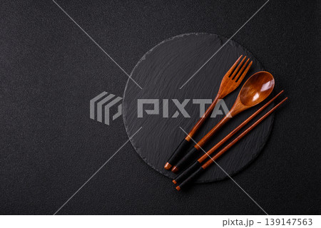 An empty round brown wooden bowl for Asian food. An empty wooden bowl An empty round brown wooden bowl for Asian food. An empty wooden bowl 139147563