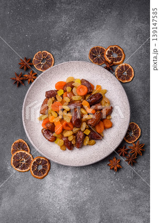 Dried apricots, raisins, and candied fruits as ingredients for baked goods and sweets. Dried fruits 139147585