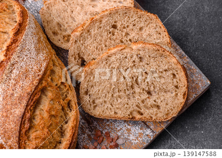 A loaf of homemade whole grain rye bread for the dinner table. A loaf of rye bread 139147588