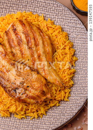 Kabsa or haneeth, an Arabic dish with rice and chicken, salt, and spices. Kabsa or haneeth 139147593