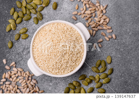 White sesame seeds in a bowl, an ingredient for oil and healthy eating. White sesame 139147637