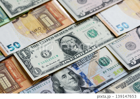 Euro and dollar banknotes, exchange, sales, economic tariffs and taxes. Euros and dollars Euro and dollar banknotes, exchange, sales, economic tariffs and taxes. Euros and dollars 139147653