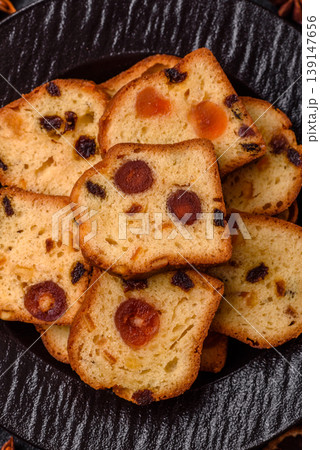 Fruit cake, a dessert with cherries, plums, and raisins for a festive Christmas table. Fruit cake Fruit cake, a dessert with cherries, plums, and raisins for a festive Christmas table. Fruit cake 139147656