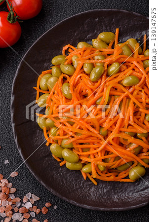 Asian salad with edamame beans, carrots, tofu, and spices. Edamame and carrot salad 139147675