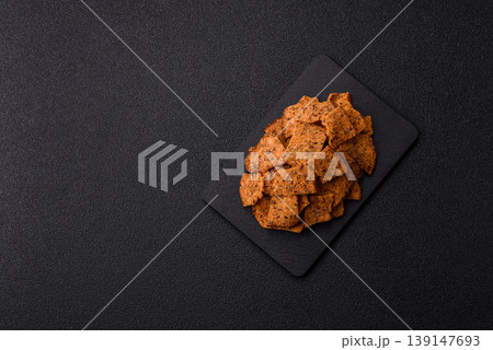 Croutons or crackers made from rye bread with garlic, salt, and spices. Croutons with salt 139147693