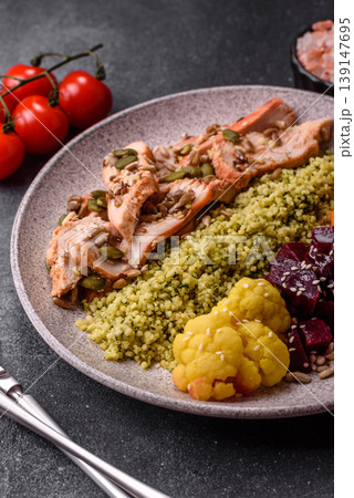 A bowl with chicken or turkey, porridge, vegetables, sauce, and spices. A meat bowl A bowl with chicken or turkey, porridge, vegetables, sauce, and spices. A meat bowl 139147695