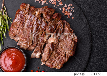 Steak, beef or pork meat grilled or barbecued with salt and spices. Beef steak Steak, beef or pork meat grilled or barbecued with salt and spices. Beef steak 139147705