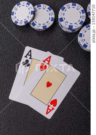 Playing cards and chips on a table, a gambling game of blackjack or baccarat. Cards and chips 139147710