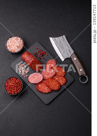 Sliced smoked pepperoni or salami as a pizza topping. Pepperoni sausage Sliced smoked pepperoni or salami as a pizza topping. Pepperoni sausage 139147713