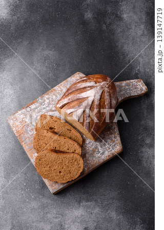 A loaf of homemade whole grain rye bread for the dinner table. A loaf of rye bread 139147719