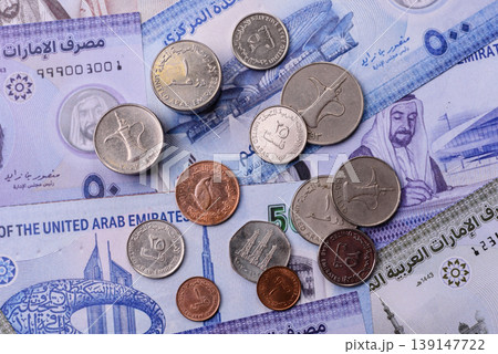 United Arab Emirates cash, dirhams and coins for exchange and financial transactions. UAE currency United Arab Emirates cash, dirhams and coins for exchange and financial transactions. UAE currency 139147722