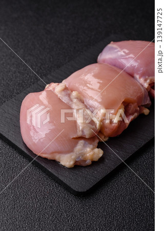 Raw chicken thigh fillet, boneless and skinless, for roasting. Raw thigh fillet Raw chicken thigh fillet, boneless and skinless, for roasting. Raw thigh fillet 139147725