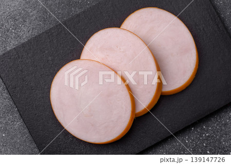 Chicken or Indian cooked sausage or ham sliced for breakfast sandwiches. Chicken sausage slices 139147726