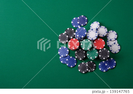 Multicolored casino chips as a conceptual backdrop for gambling games. Multicolored casino chips 139147765