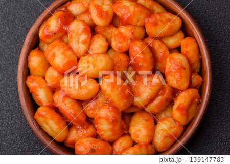 Homemade potato gnocchi with Bolognese sauce, seasoned with salt and spices. Gnocchi with sauce Homemade potato gnocchi with Bolognese sauce, seasoned with salt and spices. Gnocchi with sauce 139147783