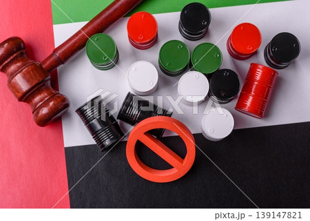 The cargo container ban on the UAE flag as a conceptual backdrop . The cargo container embargo The cargo container ban on the UAE flag as a conceptual backdrop . The cargo container embargo 139147821