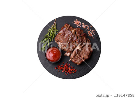 Steak, beef or pork meat grilled or barbecued with salt and spices. Beef steak Steak, beef or pork meat grilled or barbecued with salt and spices. Beef steak 139147859