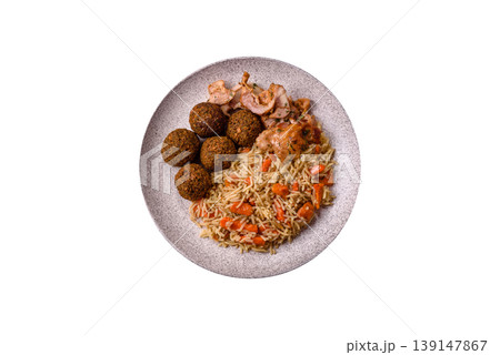Kabsa or mandi, an Arabic dish with rice and chicken, salt, and spices. Kabsa or mandi Kabsa or mandi, an Arabic dish with rice and chicken, salt, and spices. Kabsa or mandi 139147867