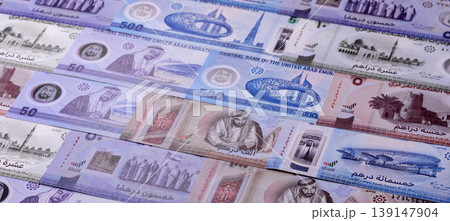 United Arab Emirates cash, dirhams and coins for exchange and financial transactions. UAE currency 139147904