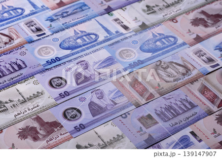 United Arab Emirates cash, dirhams and coins for exchange and financial transactions. UAE currency 139147907