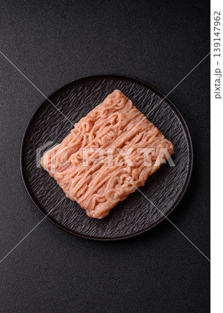 Raw fresh ground chicken, turkey, or pork for burgers or meatballs. Raw ground chicken Raw fresh ground chicken, turkey, or pork for burgers or meatballs. Raw ground chicken 139147962