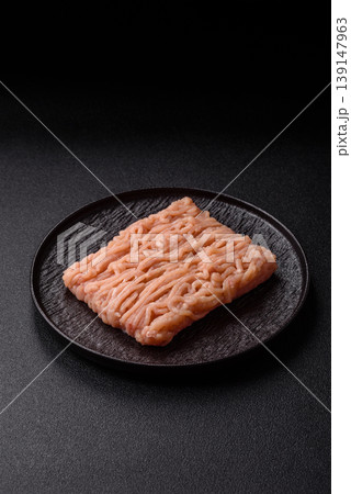 Raw fresh ground chicken, turkey, or pork for burgers or meatballs. Raw ground chicken Raw fresh ground chicken, turkey, or pork for burgers or meatballs. Raw ground chicken 139147963